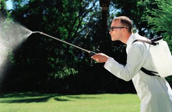 man with battery pack sprayer
